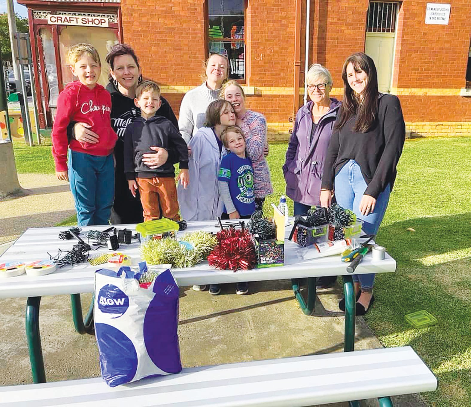 Santa’s helpers... (From left): The Boxtel and Mangan families, with Dianne Hill and LOL’s Stacey Taylor ready to bring the merry to Melville Street.