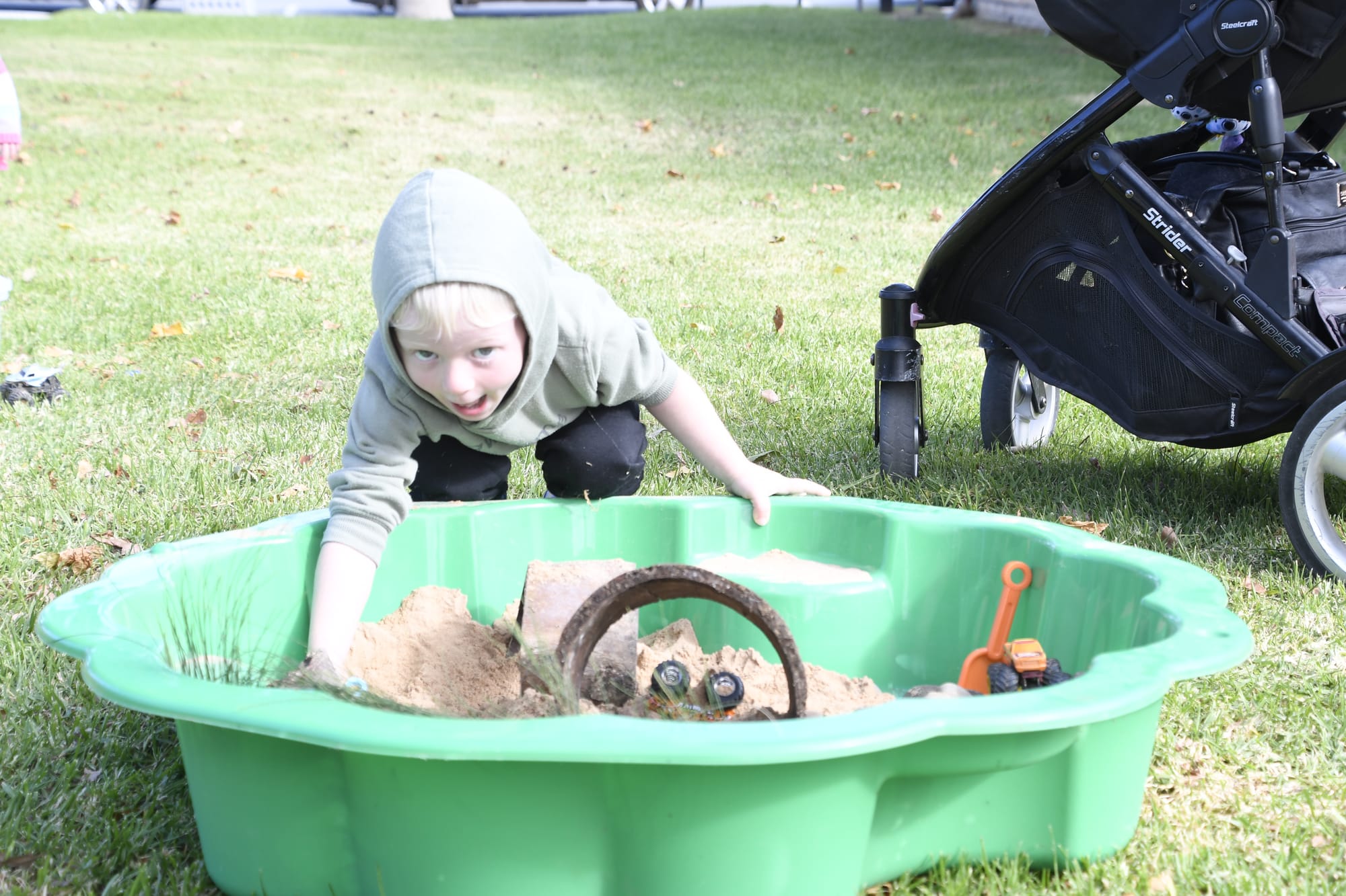 Cheeky ... Declan Bruce couldn’t get enough of the sandpit.
