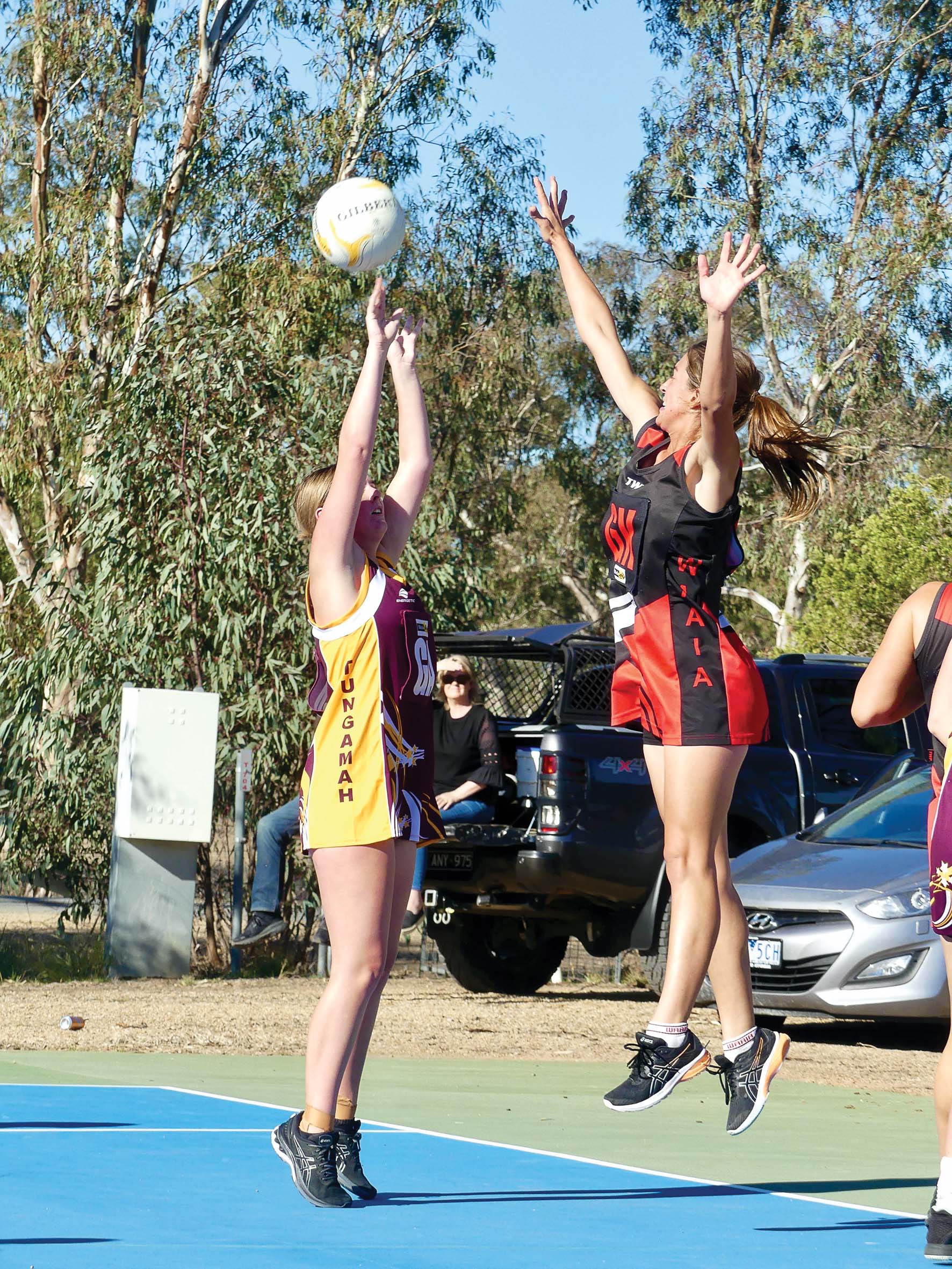 Fugitive from gravity ... Matyka Walpole climbs high into the air to defend a Tungamah shooter. 