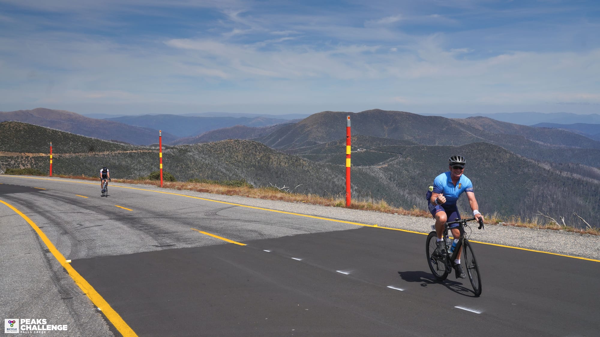 Hitting his peak ... Geoff Holmes (right) takes a moment to enjoy the ride on his way up an incline during the Peak Challenge.