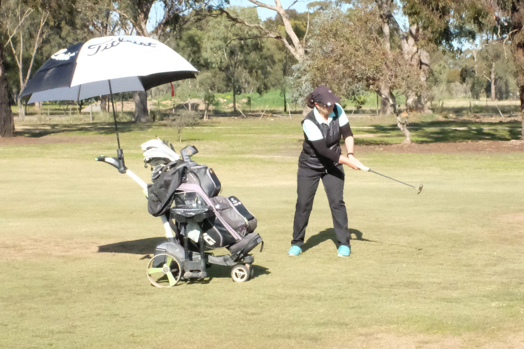 Four seasons ... Tracey Clouston plays a favourite shot, with a putter from off the green during last Wednesday’s first round of the club championship.