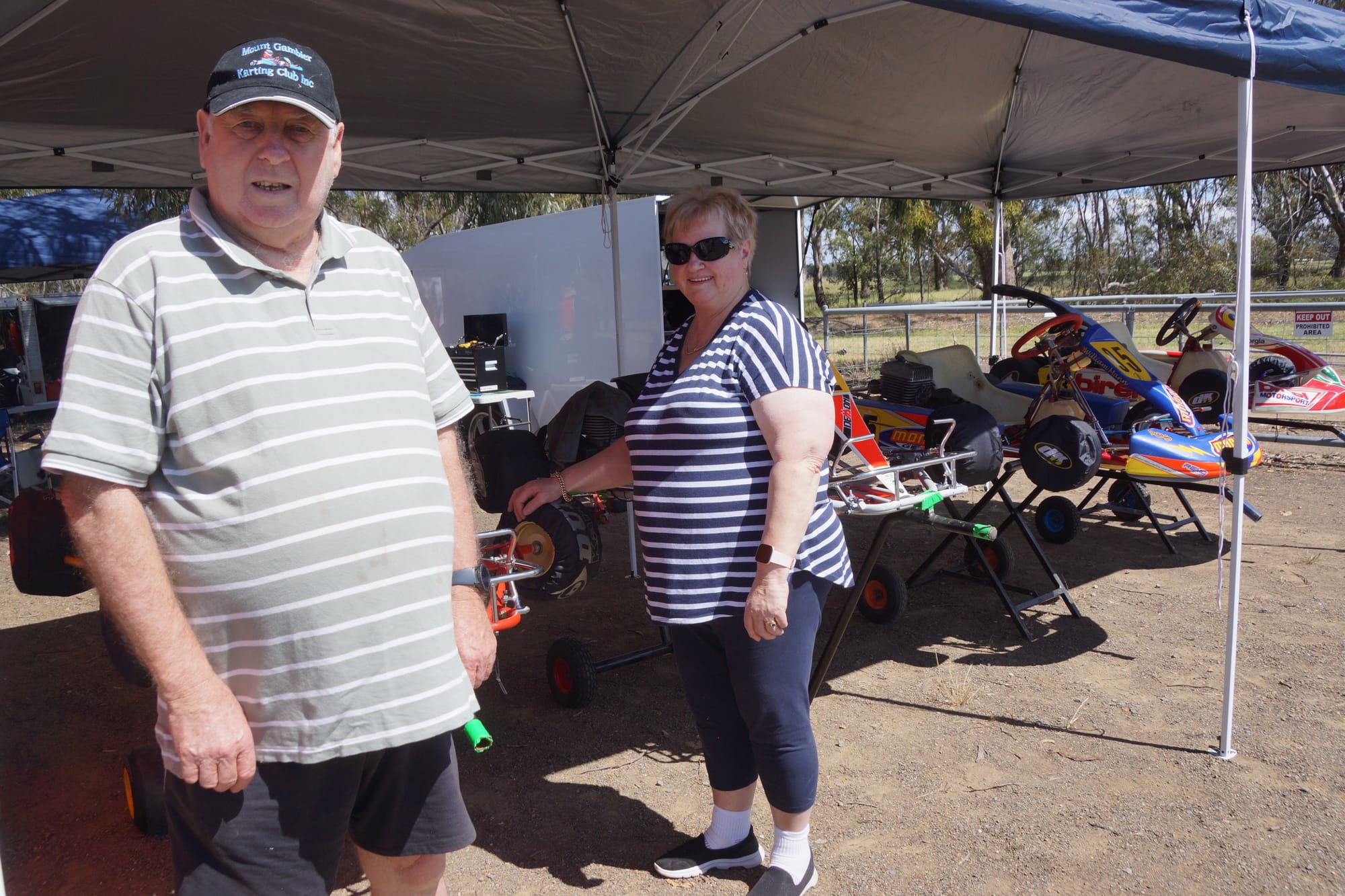 Rev heads... Geoff (left) and Linda Wade with a few of the vintage go-karts last weekend. 
