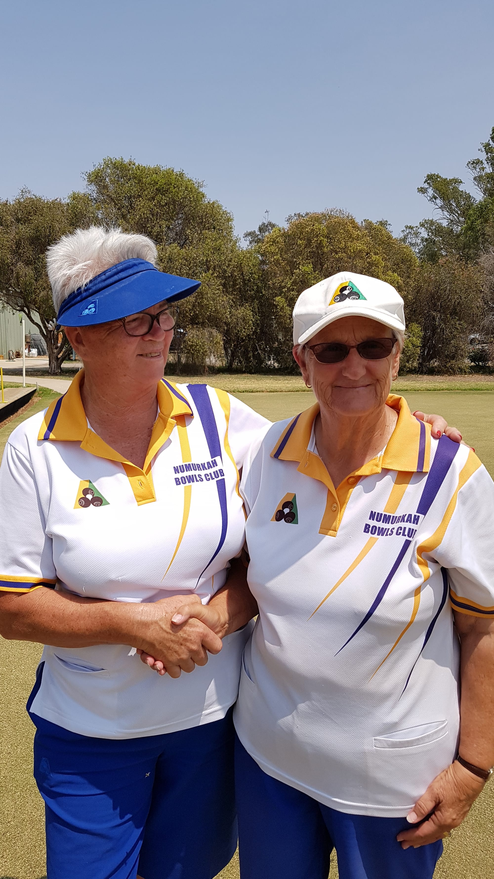 Still standing ... Viv Morris congratulates Ann Dealy after their marathon championship final.