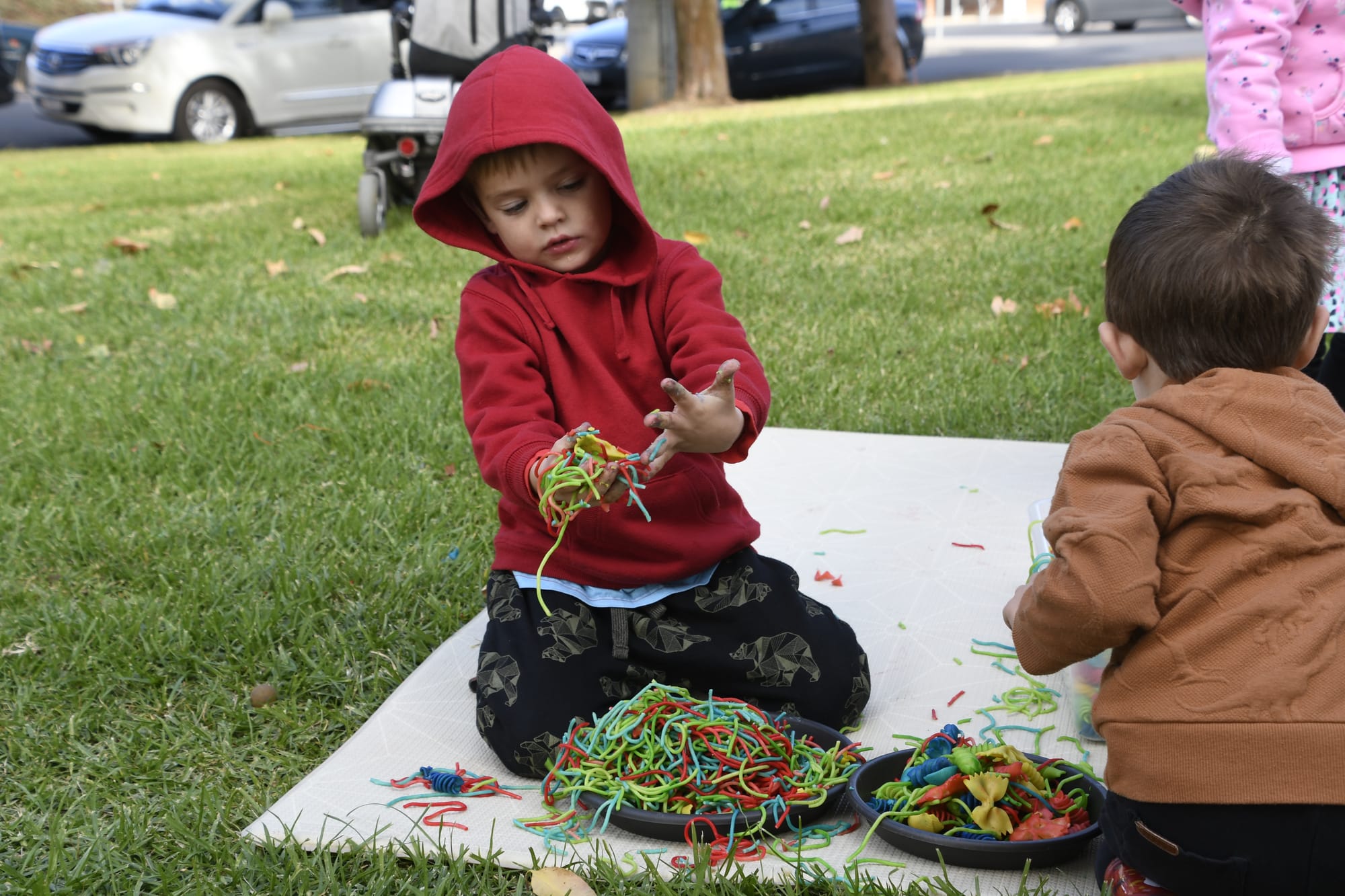 Getting his hands dirty ... Jenson Mortlock had a ball with the colourful spaghetti. 
