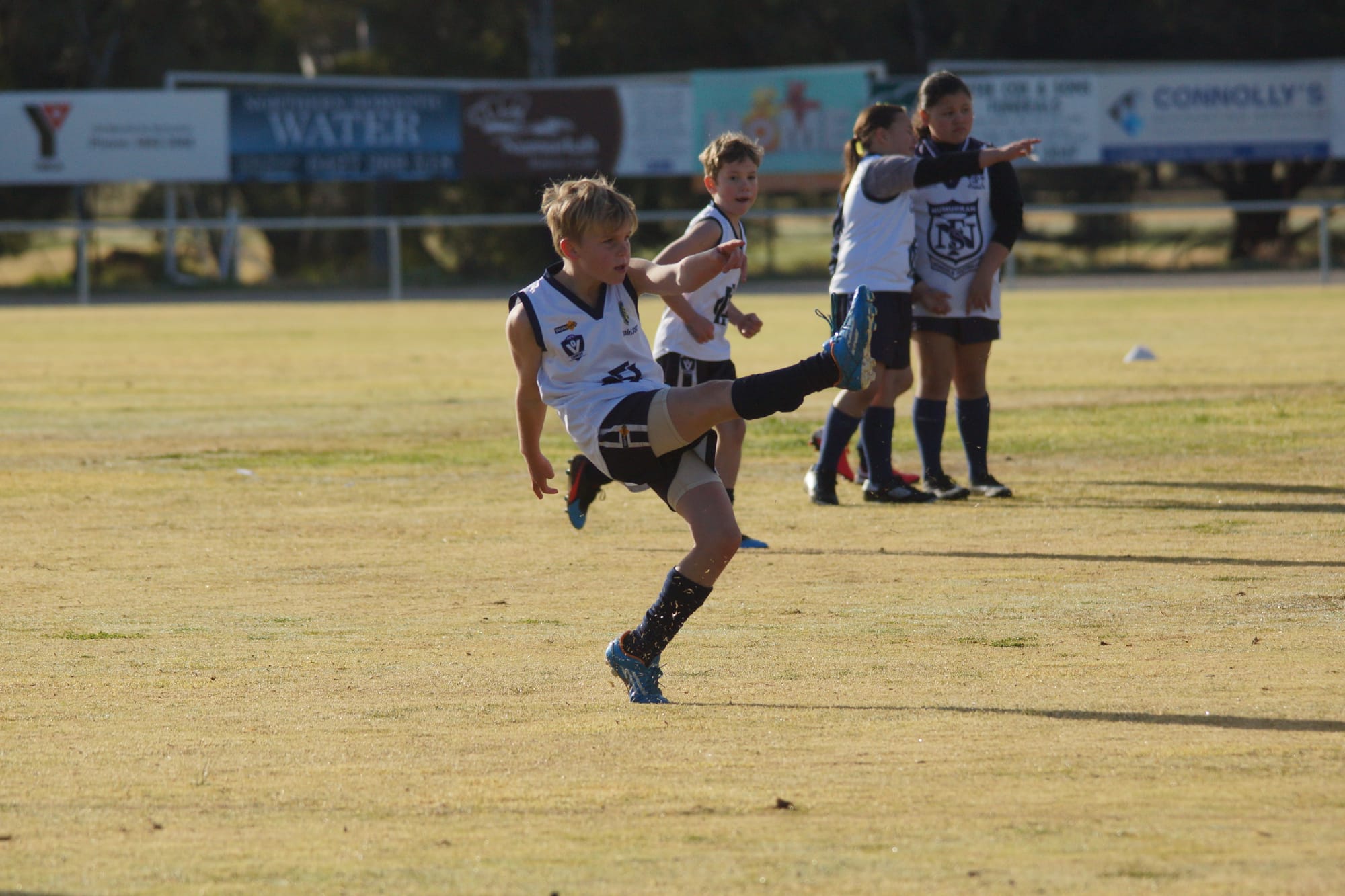 Style ... Keyon Taylor-Wilton gets away one of his many kicks for the under 10s on Saturday.