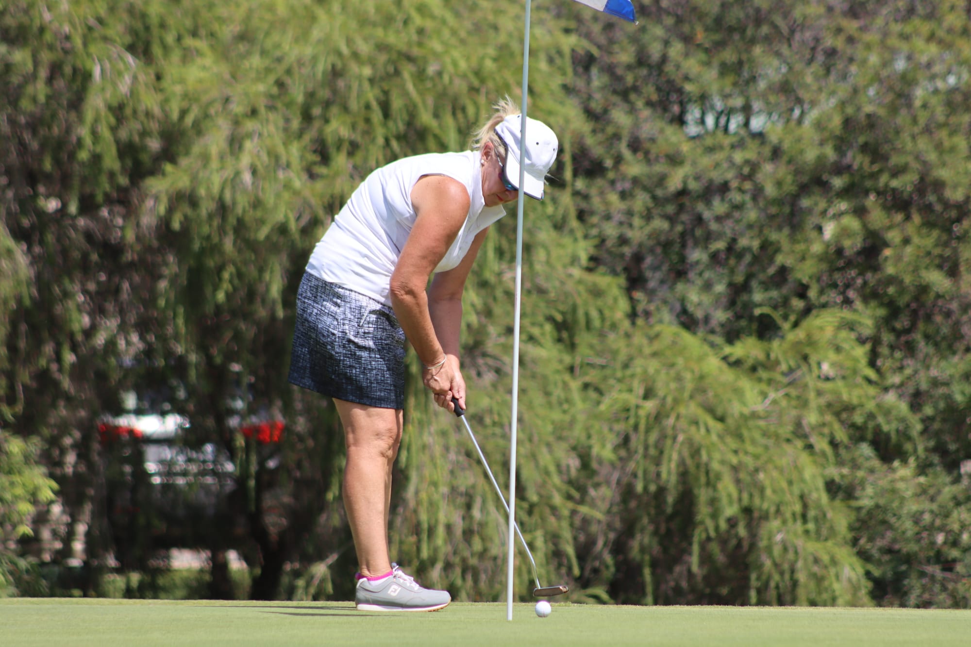 In the hole ... Margot McGrath putting one in, before drizzly rain made conditions much more difficult later on. 
