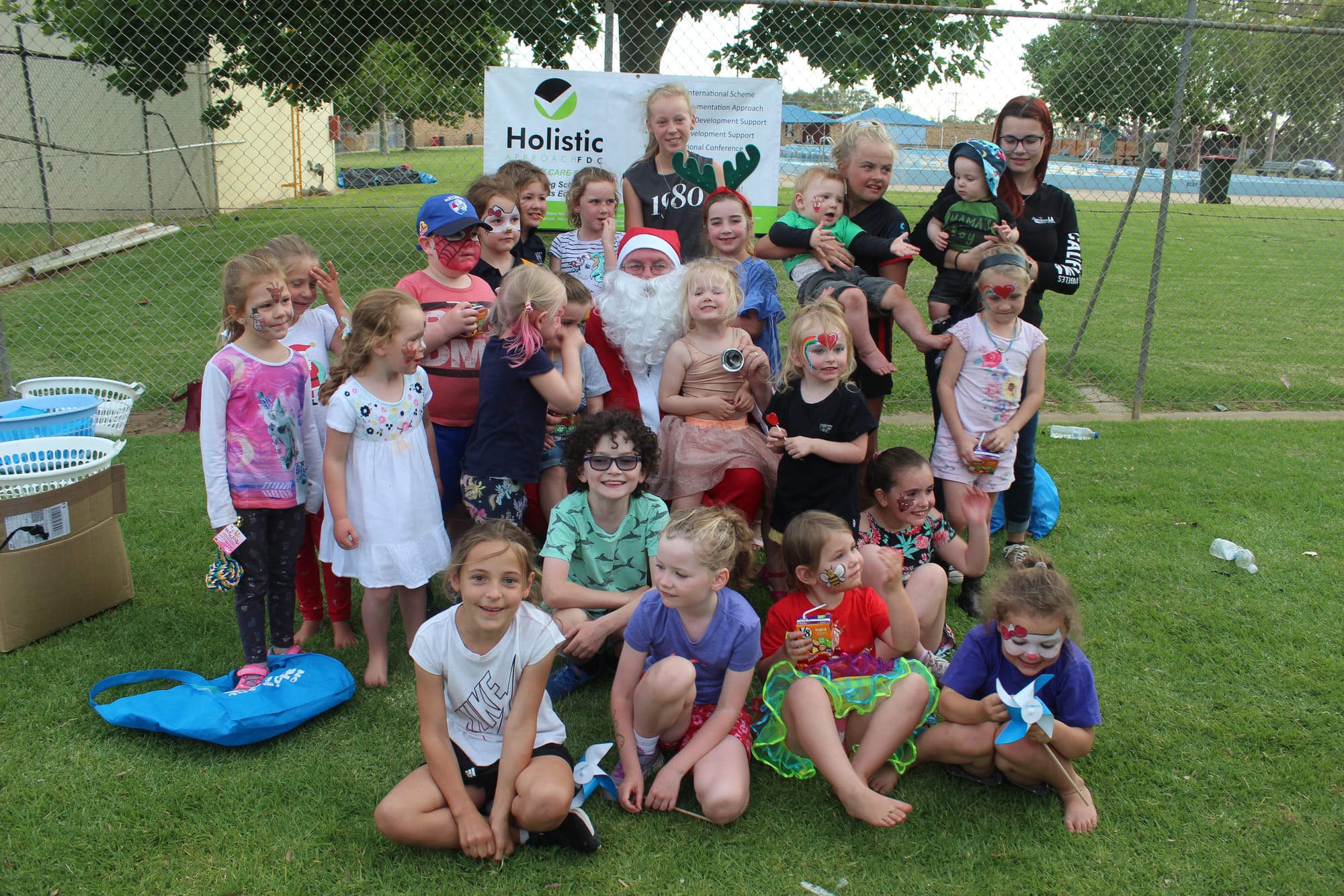Happy kids ... The Holistic Approach family day care kids had an early visit from Santa, and they were all very happy to see him.