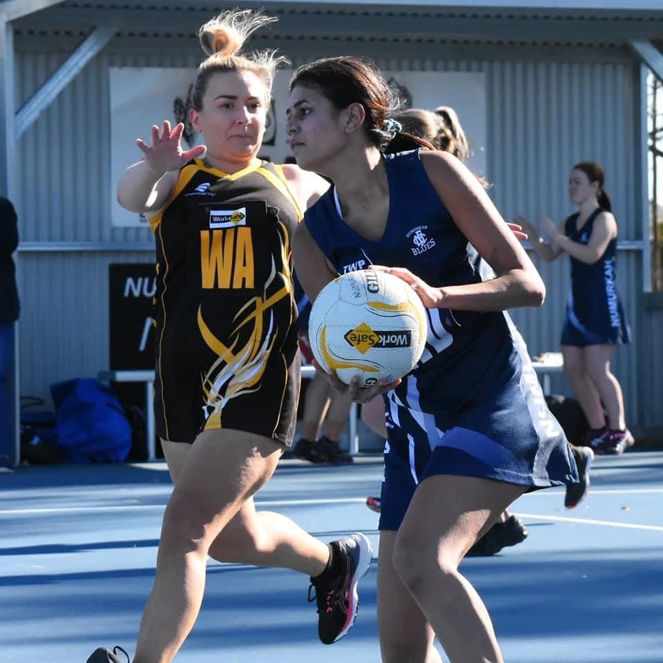 Safe hands ... Teshia Koo-aga keeps Cobram’s wing attack at bay.
