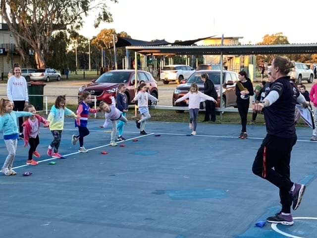Balanced ... NetSetGo facilitator Leanne Rawson works with some of the young netty stars.