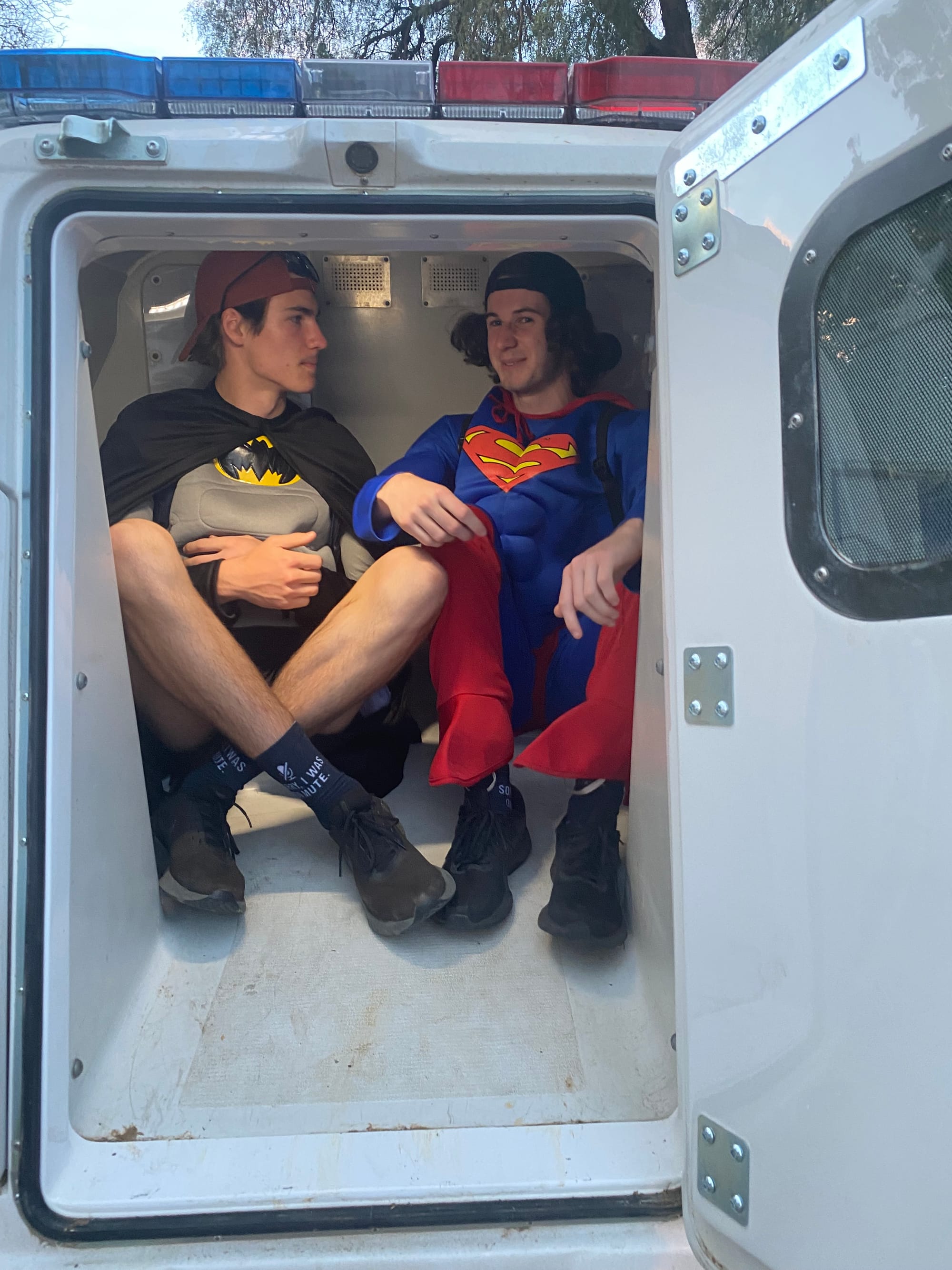 Locked up... Dylan Craven (left) and Fraser Jones in the back of the divvy van.
