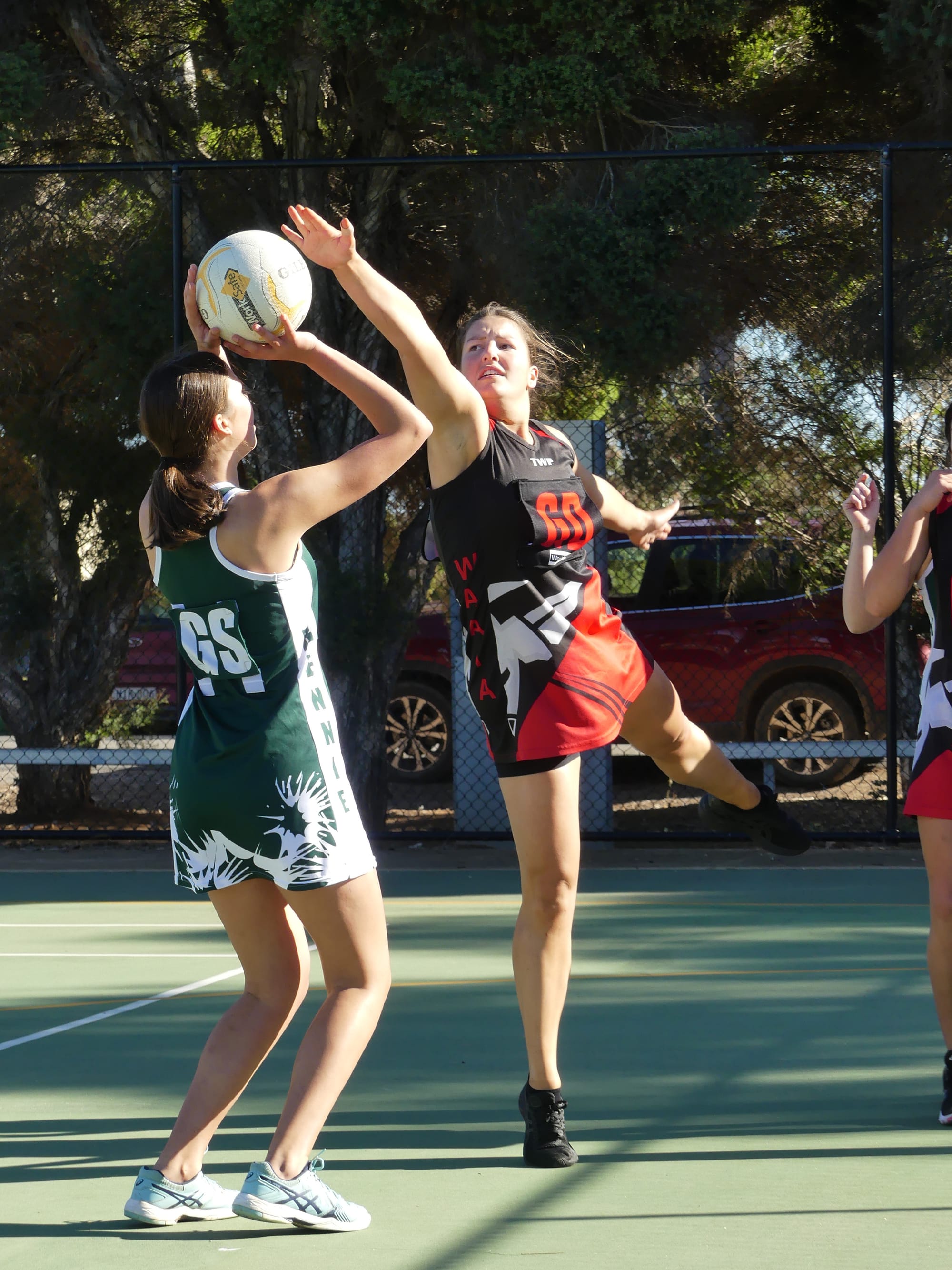 Full stretch ... Milly Foster defends a Rennie shot at goal. 