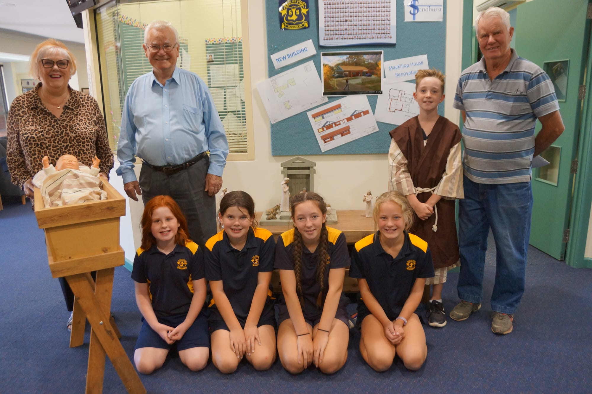 Keen cast and crew ... Organisers and nativity actors (Back from left): Marie Martin, Alf Seiter, Cooper Weeks, Keith Nicoll (front): Lacey Schulz, Zoe Hawthorn, Bethany Pellegrino and  Ashlee Dyson, are ready for carols by candlelight.