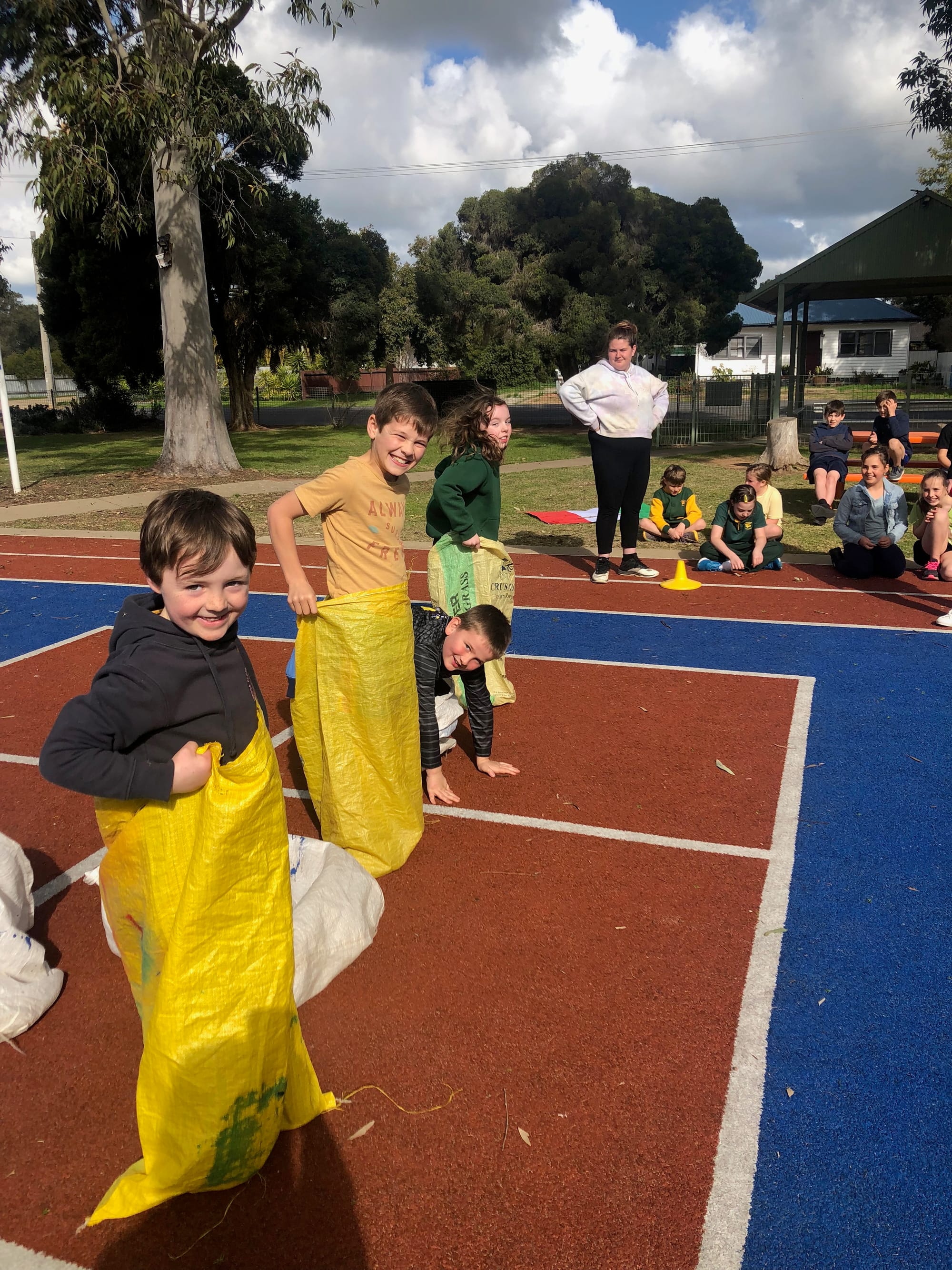 Popular event... (From left): Sonny Stokes, Max Bayne, Kael Carmody and  Jessica Anderson are keen to see sack racing added as an event at the 2032 Brisbane Olympics.
