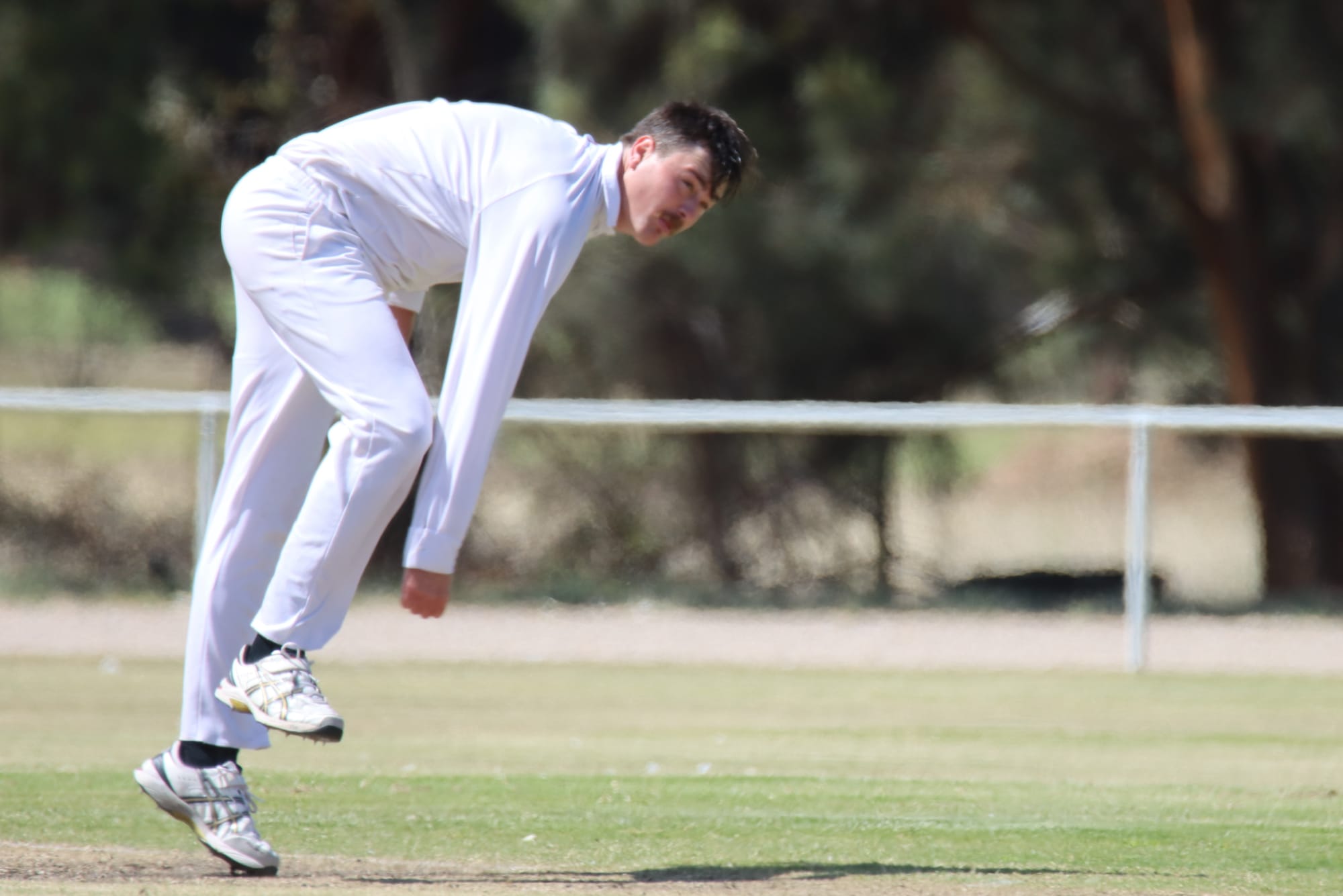 In full swing … Matt Cline sends down a bullet.