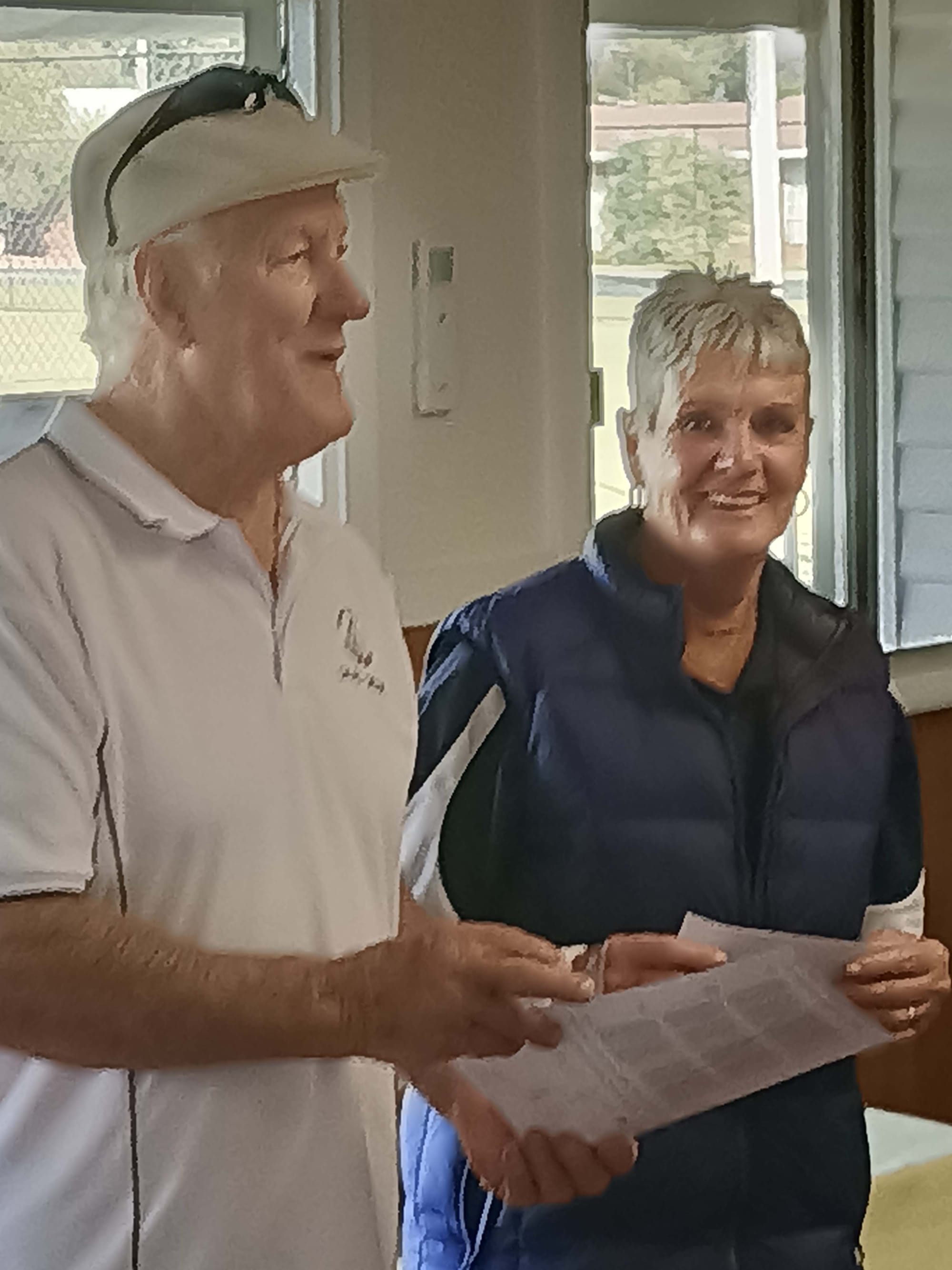 Presentation ... Club president David Geddes presents Helen Brierly with the winner’s cheque. 
