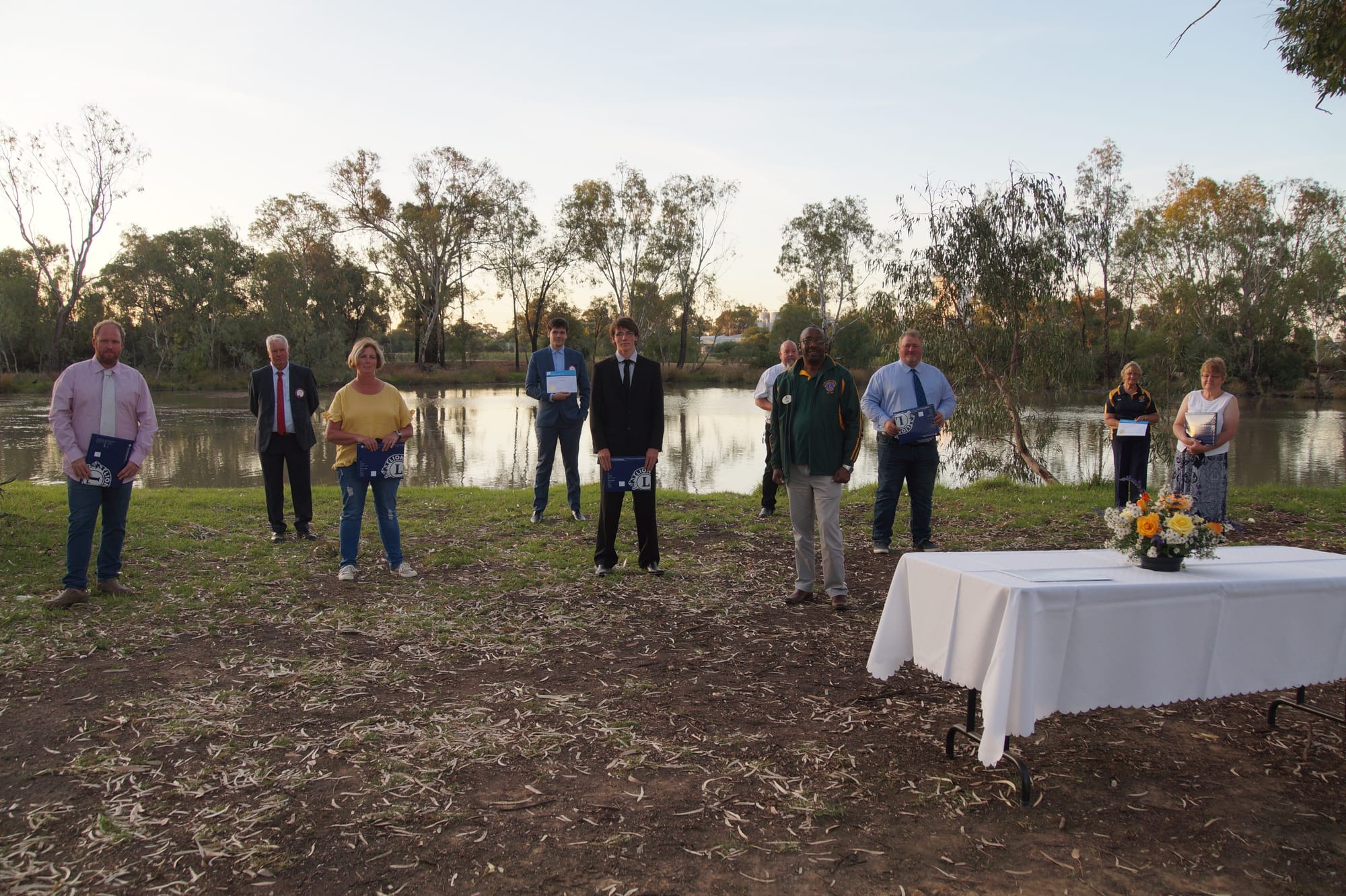 Lions new and old keeping their distance ... New Numurkah Lions members and their nominees, from left: Chris Boyden, Keith Nicoll, Sue McCracken, Jack Fischer, Harry Fischer, Mark Nordbye, district governor Omen Ndlovu, David Morris, Elsie Sparrowhawk and Lea Tyndall. 