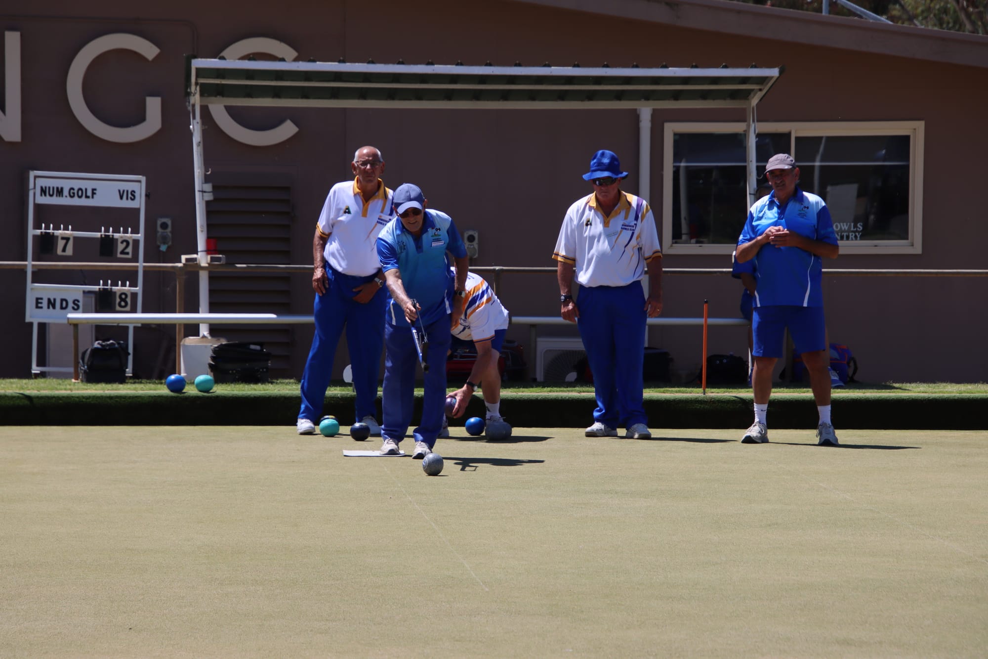 Under watch ... Noel Newham, Paul Rees and Neil Hutchins keep a close eye on Syd Roughsedge as he puts another one close to the kitty.